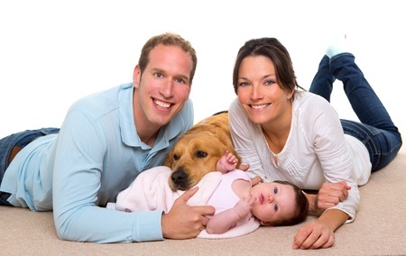 Family with new born baby and dog